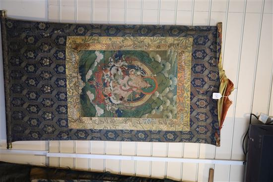 A thangka depicting Padmasambhava in the form of Nyima Ozer, Tibet, 19th century Total dimensions 133cm x 86cm